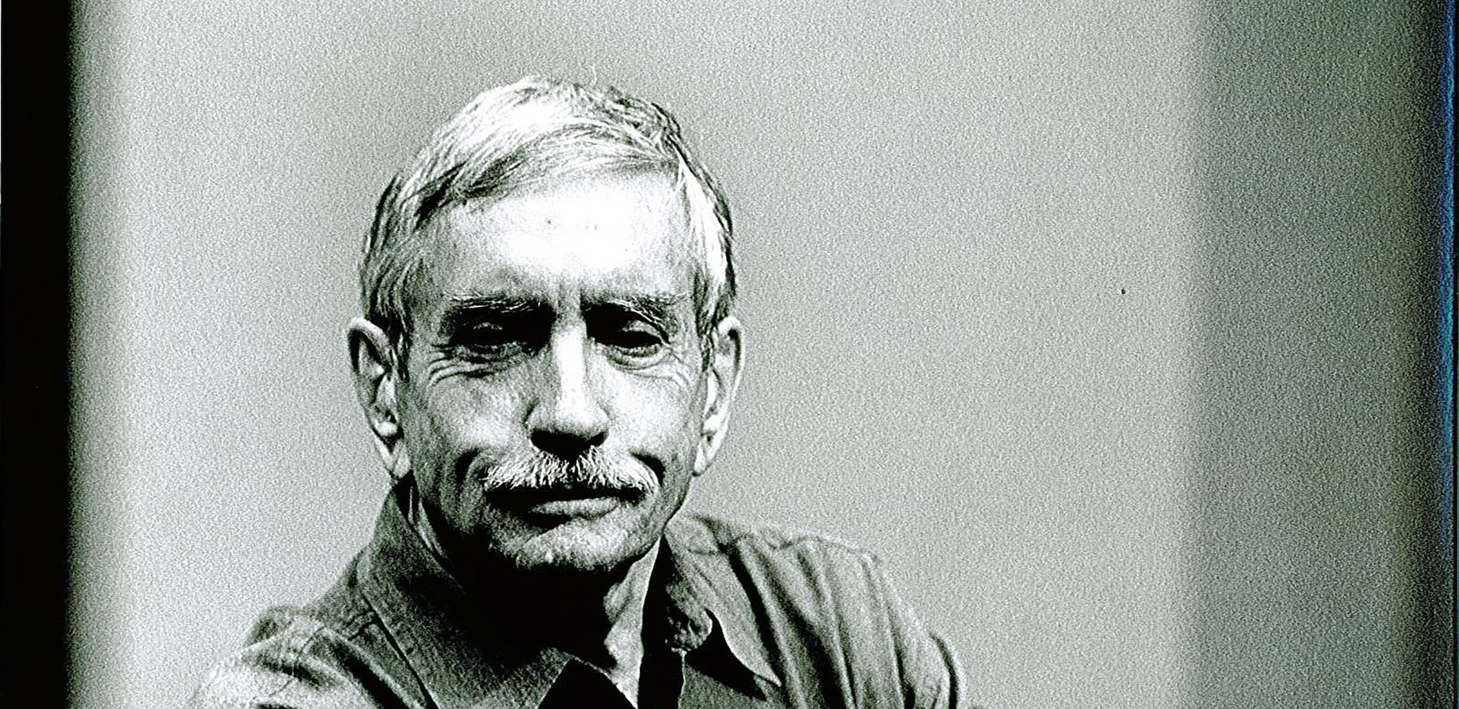 Black and white photograph of Edward Albee, seated.