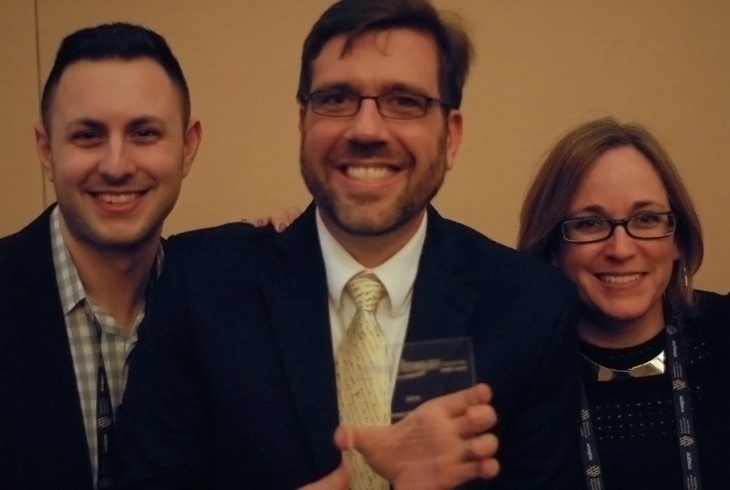 David McKenzie (this blog's author) stands holding the MUSE Award.